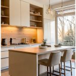 Minimalist Modern Ivory Kitchen with Warm Lighting