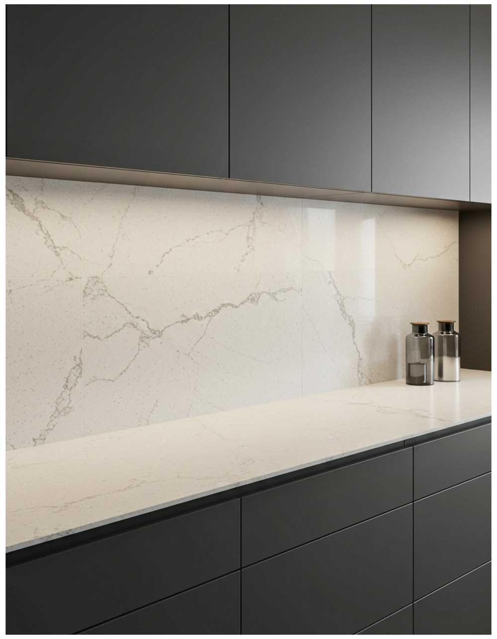 A sleek backsplash made from oversized slab tiles in polished marble or light quartz, flowing seamlessly up the wall. Pair with minimalist cabinets and soft, ambient lighting for a clean look.